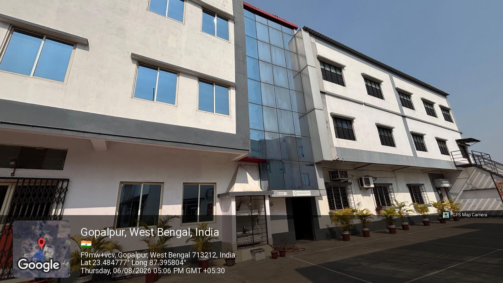 Side elevation of the academic blocks at School of Hospitality & Management, Durgapur, with the glazed stairwell between them
