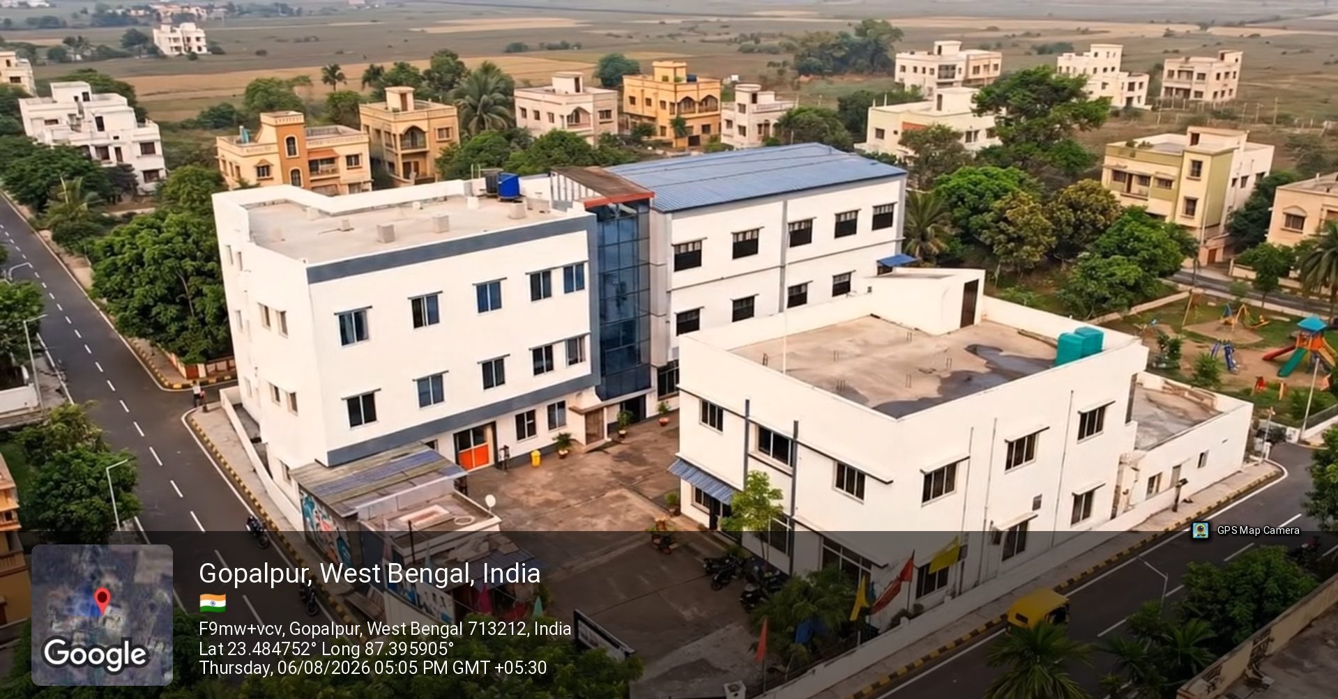 Aerial view of the School of Hospitality & Management campus at Rajbandh, Durgapur, showing both academic blocks, the courtyard between them and the approach road