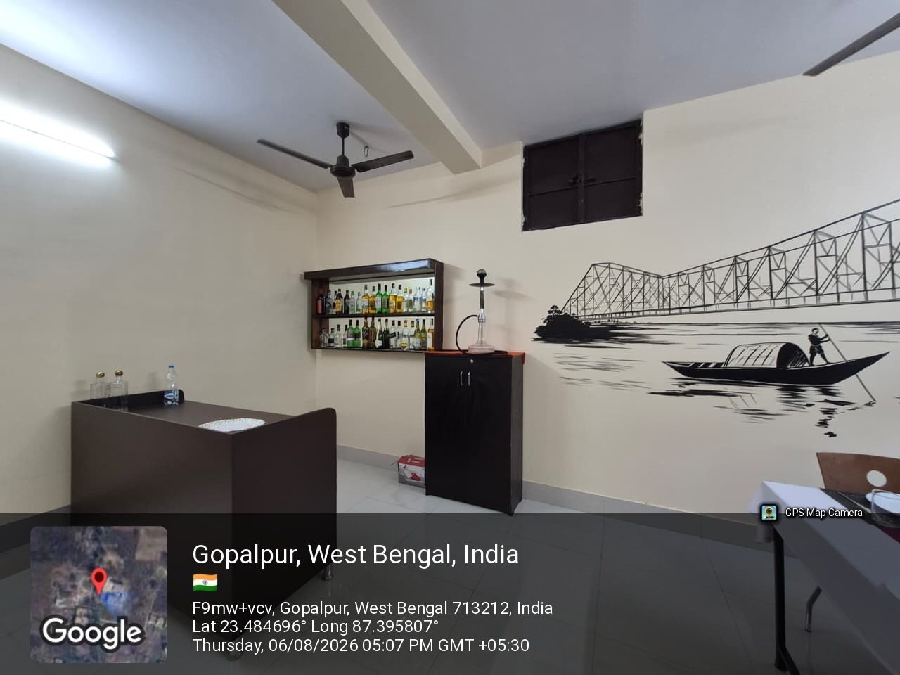 The food and beverage service lab at School of Hospitality & Management, Durgapur, with the mock bar and the Howrah Bridge mural behind it
