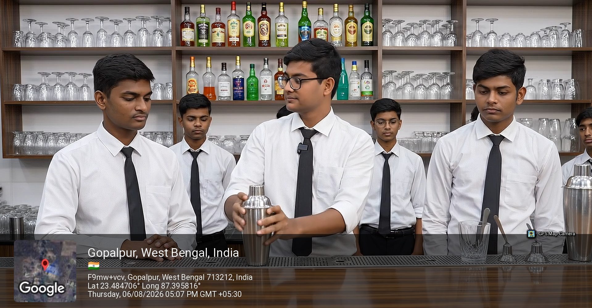 Students practising cocktail preparation with a shaker behind the mock bar at School of Hospitality & Management, Durgapur