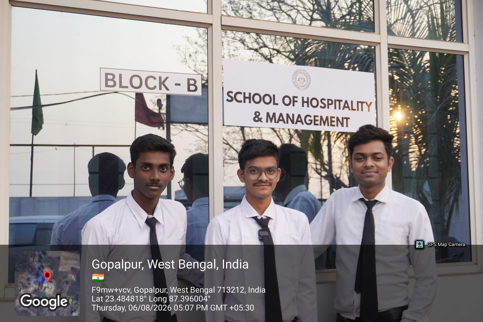 Hotel management students in service uniform outside the Block B entrance at School of Hospitality & Management, Durgapur