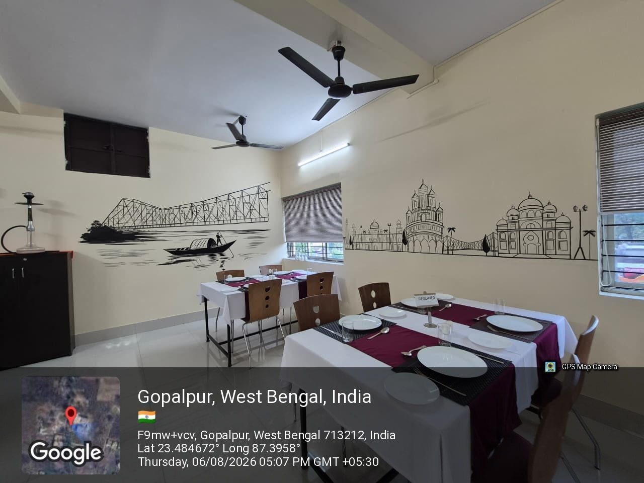 Tables laid with covers, napkins and glassware in the training restaurant at School of Hospitality & Management, Durgapur